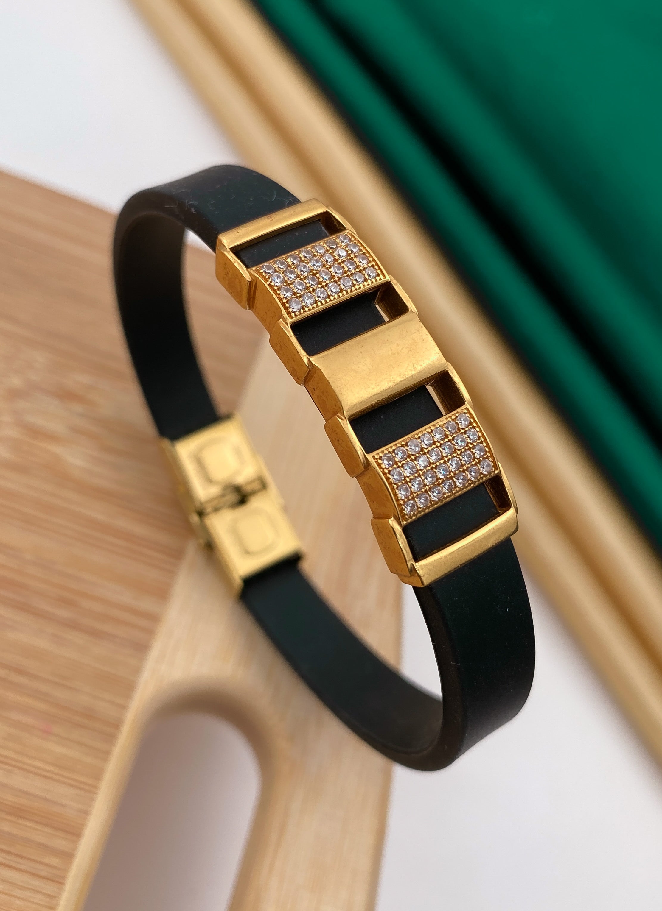 One by one stair gold plated diamonds in black silicone bracelet for men